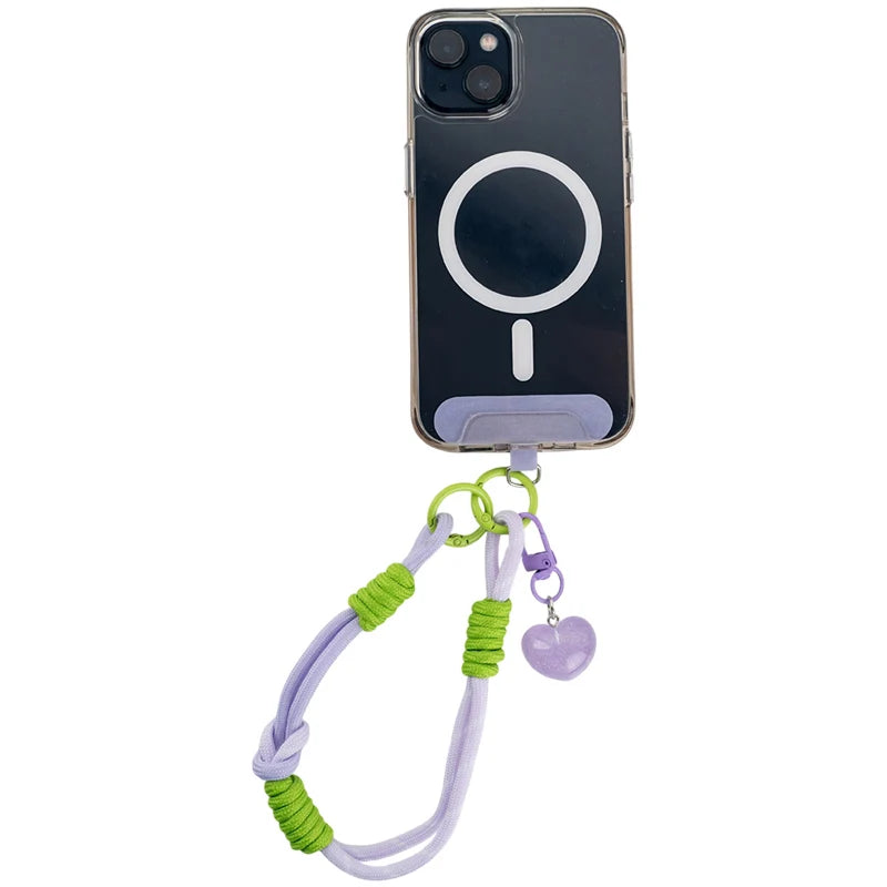 Fioletowy pasek Kite zamocowany do etui smartfona za pomocą uniwersalnej wkładki
